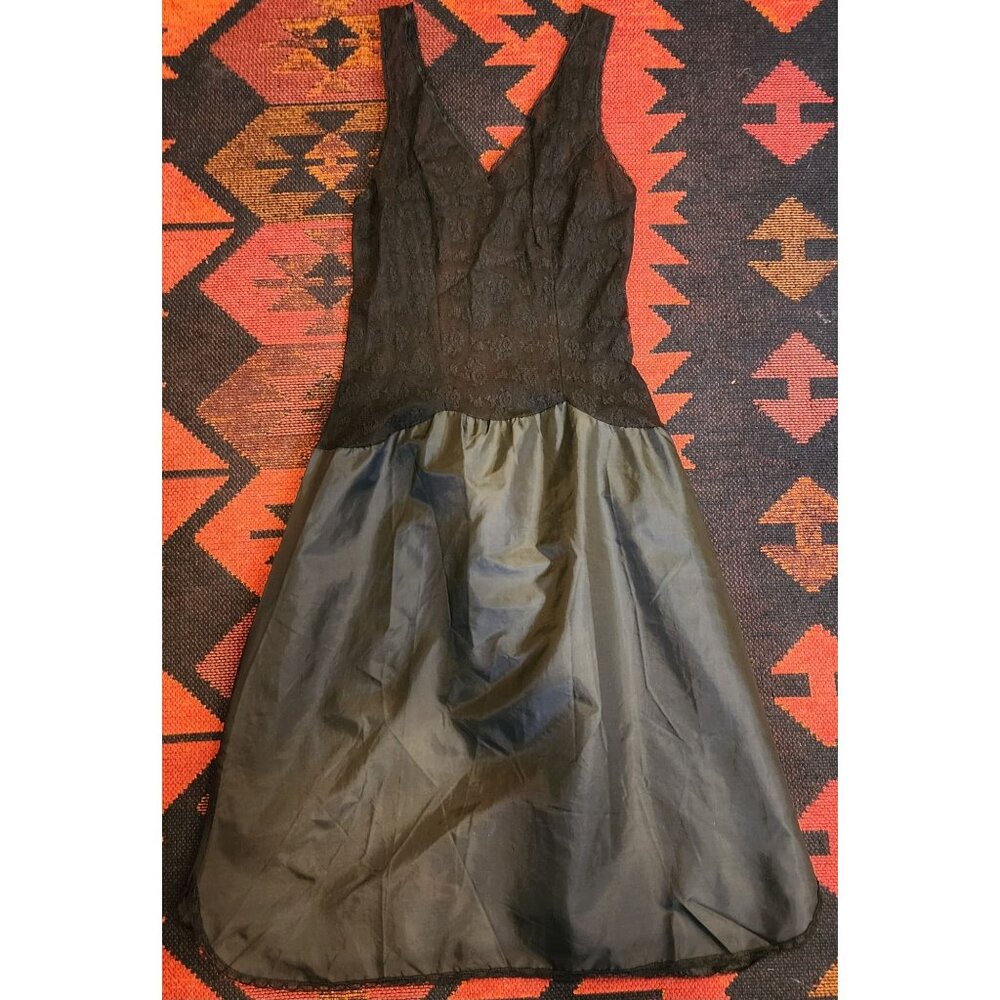 Black Lace & Satin Sleeveless V-Neck Slip Dress With Flared Skirt.